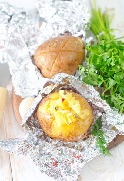 baked potato in foil Stock photo © tycoon