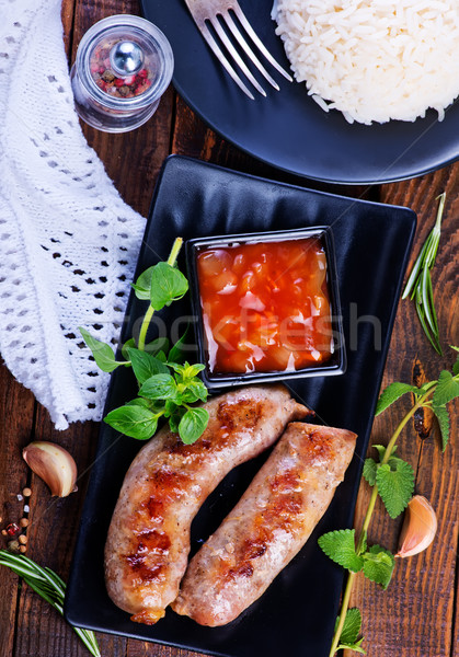 Stock photo: boiled rice with sausages