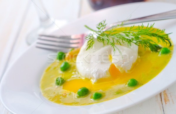 Fresh soup from green peas and egg-poached Stock photo © tycoon