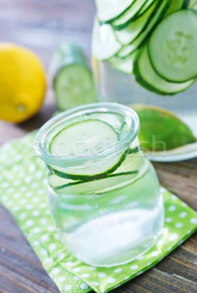 Pepino beber água grama vidro fundo Foto stock © tycoon