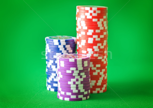 Group from chips for poker on the green background Stock photo © tycoon