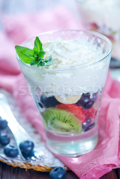 Gyümölcssaláta gyümölcs mix tejszínhab üveg természet csoport Stock fotó © tycoon