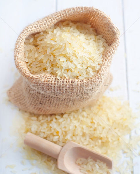 Raw rice on the table, portion of the raw rice Stock photo © tycoon