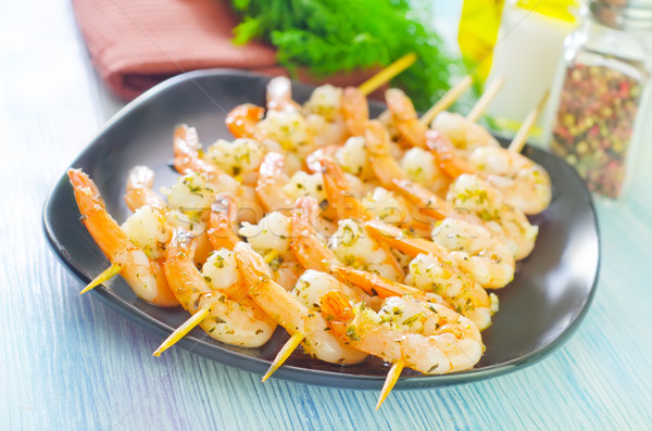 Stock photo: boiled shrimps are beaded on sticks