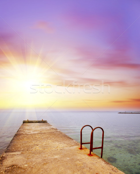 Mar costa praia sol pôr do sol luz Foto stock © tycoon
