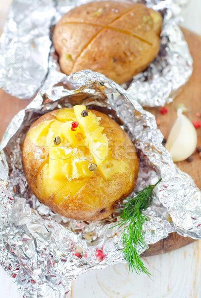 baked potato in foil Stock photo © tycoon