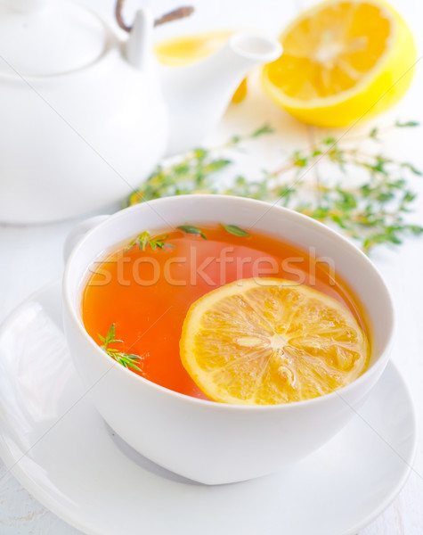 Fresh tea with lemon in the white cup Stock photo © tycoon