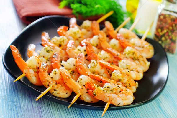 boiled shrimps are beaded on sticks Stock photo © tycoon