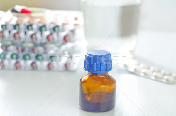 bottle, tablets and capsules Stock photo © tycoon