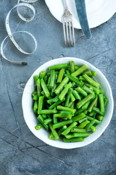 Grünen Bohnen Schüssel Tabelle Essen Hintergrund grünen Stock foto © tycoon