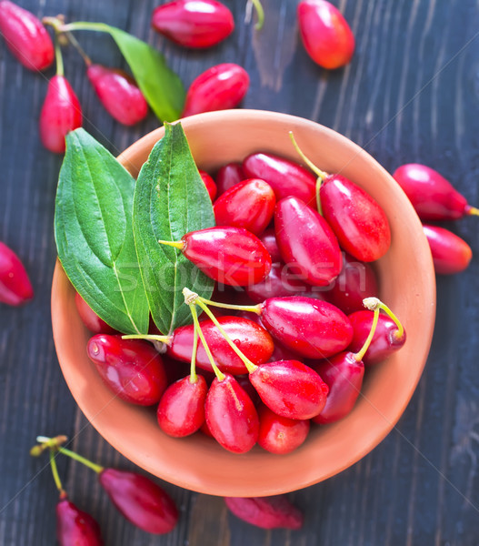 Foto stock: Tigela · tabela · natureza · fundo · verde · vermelho