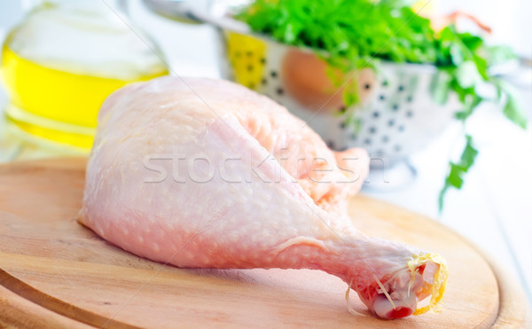 Raw chicken and knife on the wooden board Stock photo © tycoon