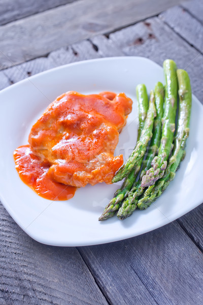 Stock photo: fried meat with sauce and asparagus