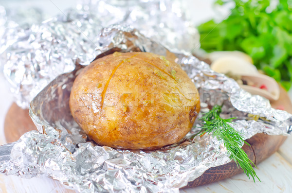 baked potato in foil Stock photo © tycoon