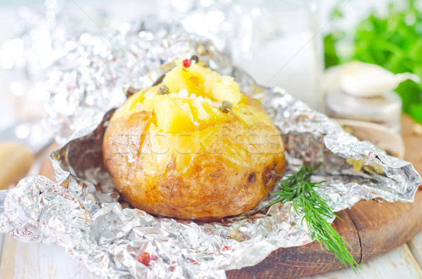 baked potato in foil Stock photo © tycoon