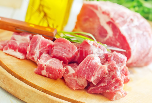 raw meat and knife on the wooden board Stock photo © tycoon