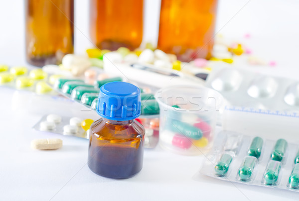 color pills and medical bottle Stock photo © tycoon