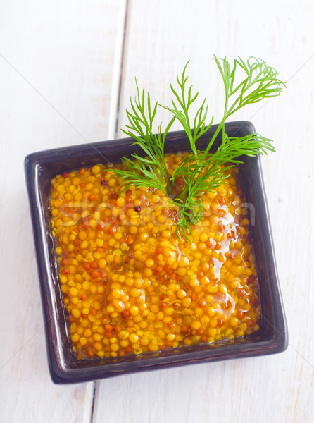 Mustard in the black bowl on table Stock photo © tycoon