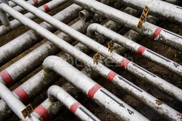array of old pipes with arrows Stock photo © ultrapro