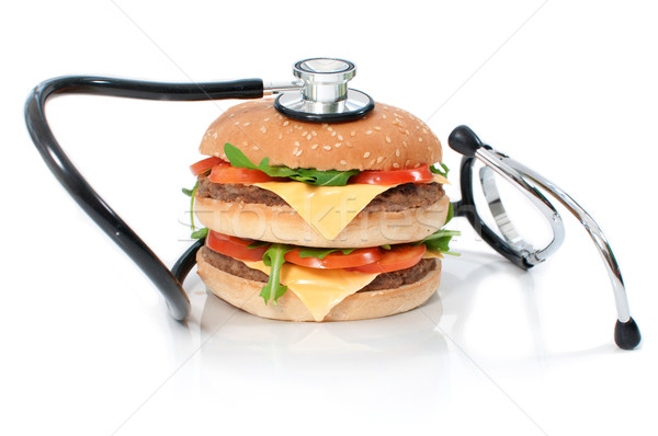 Insalubre burger estetoscópio em torno de dobrar cheeseburger Foto stock © unikpix