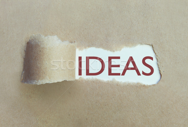 Torn paper uncovering ideas  Stock photo © unikpix