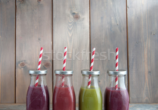Smoothies in bottles with a straw  Stock photo © unikpix
