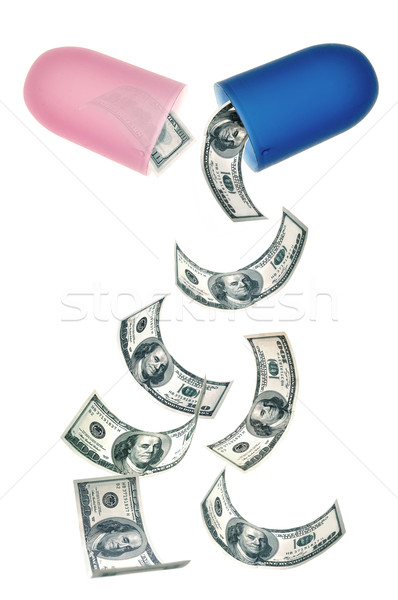Gezondheidszorg dollar bankbiljetten vallen uit pil Stockfoto © unikpix