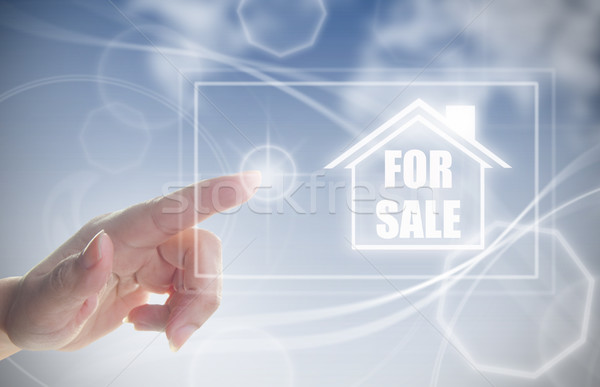 Hand clicking on house for sale Stock photo © unikpix