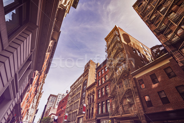 Old apartment buildings and fire escapes Stock photo © unkreatives
