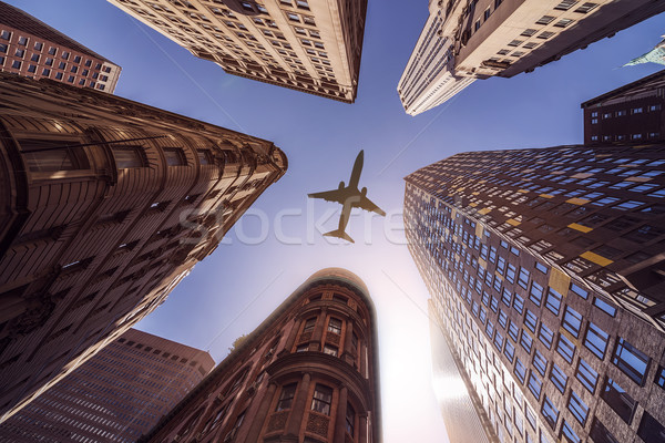 Avião high-rise edifícios voador edifícios de escritórios sol Foto stock © unkreatives