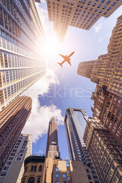 Repülőgép toronyház épületek repülés irodaépületek nap Stock fotó © unkreatives