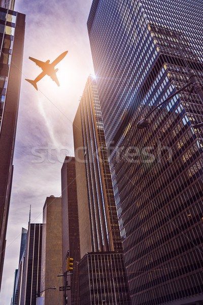 plane over office towers Stock photo © unkreatives