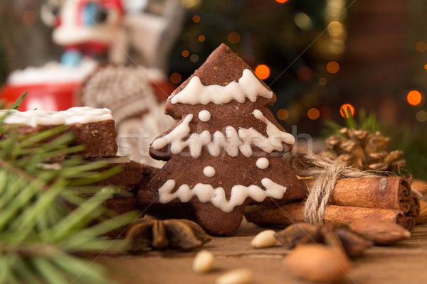 Christmas gingerbread cookies against background branch of fir t Stock photo © user_11056481
