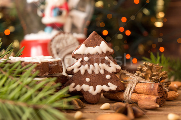 Christmas gingerbread cookies against background branch of fir t Stock photo © user_11056481