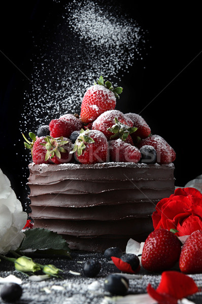 Cake with chocolate decorating with strawberry and flowers Stock photo © user_11056481