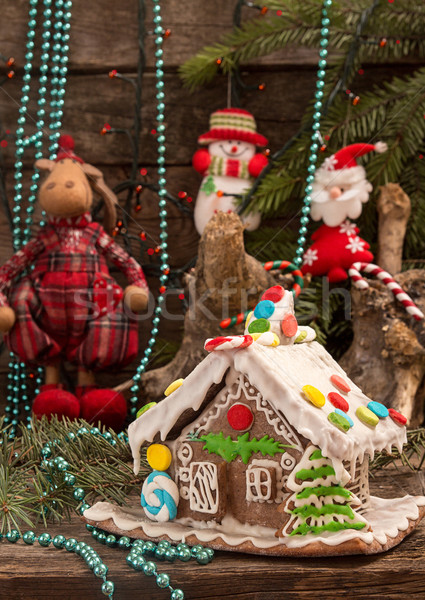 Christmas gingerbread house and holiday decorations on old woode Stock photo © user_11056481