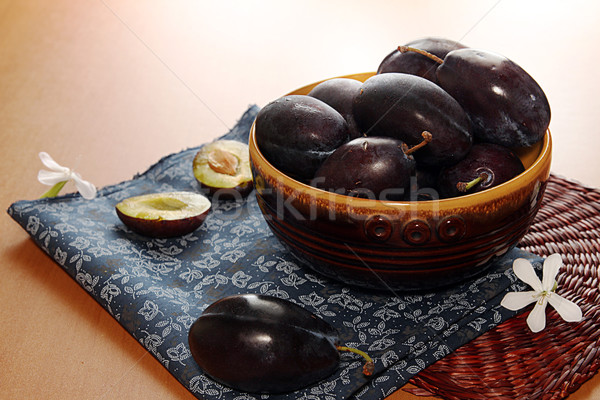 Organic homegrown plums in ceramic bowl  Stock photo © user_11056481