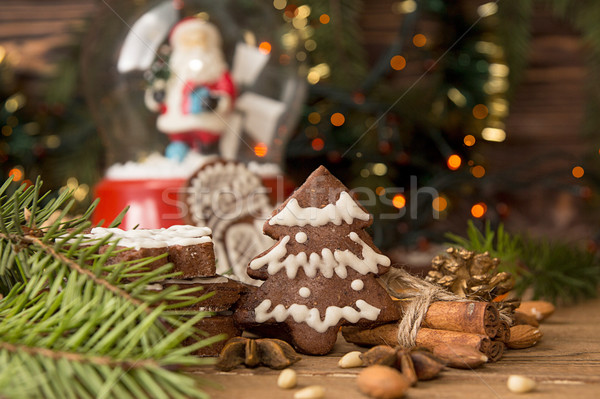 Christmas gingerbread cookies against background branch of fir t Stock photo © user_11056481