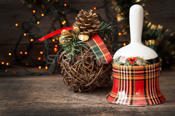 Christmas checkered bell on wooden table against background Chri Stock photo © user_11056481