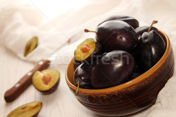 Organic homegrown plums in ceramic bowl Stock photo © user_11056481