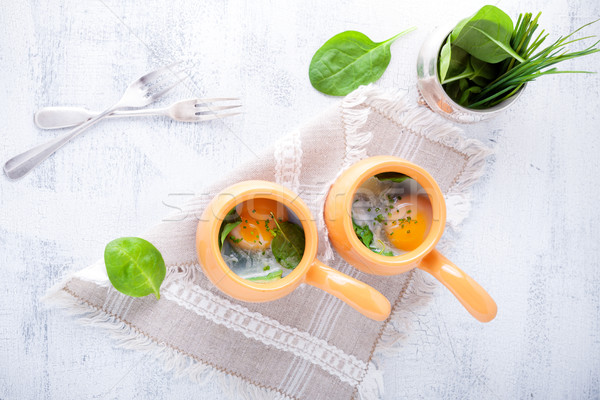 Stock photo: Baked eggs with spinach