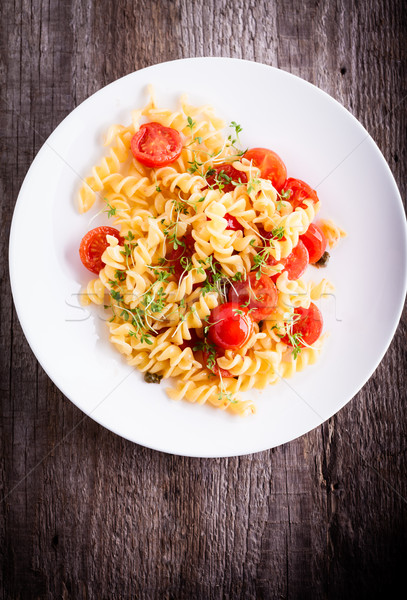 Fussili pasta with watercress and cherry tomatoes. Stock photo © user_11224430