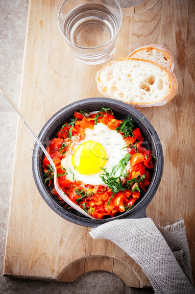 Traditional middle eastern dish of shakshuka in a pan. Stock photo © user_11224430