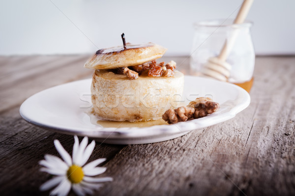 Baked apple with nuts and raisins Stock photo © user_11224430