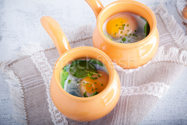 Gebakken eieren spinazie parmezaan ontbijt kaas Stockfoto © user_11224430