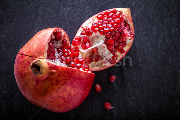 Pomegranate on a stone plate Stock photo © user_11224430