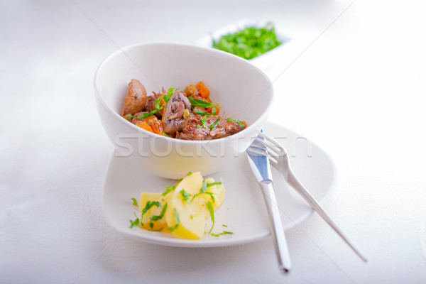 Beef stew, garnished with potatoes and champignons. Stock photo © user_11224430