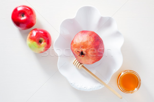 Apples, pomegranate and honey for Rosh Hashanah Stock photo © user_11224430