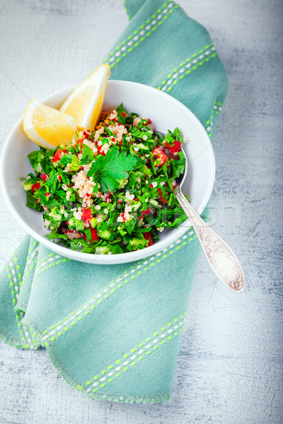 Quinoa tabbouleh salad on a wooden table Stock photo © user_11224430