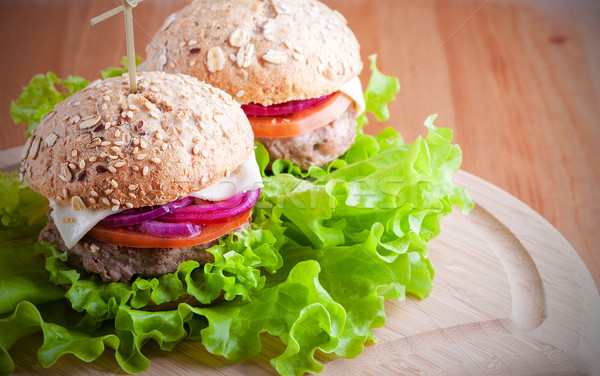 Cheeseburger salata soğan domates taze ekmek Stok fotoğraf © user_11224430